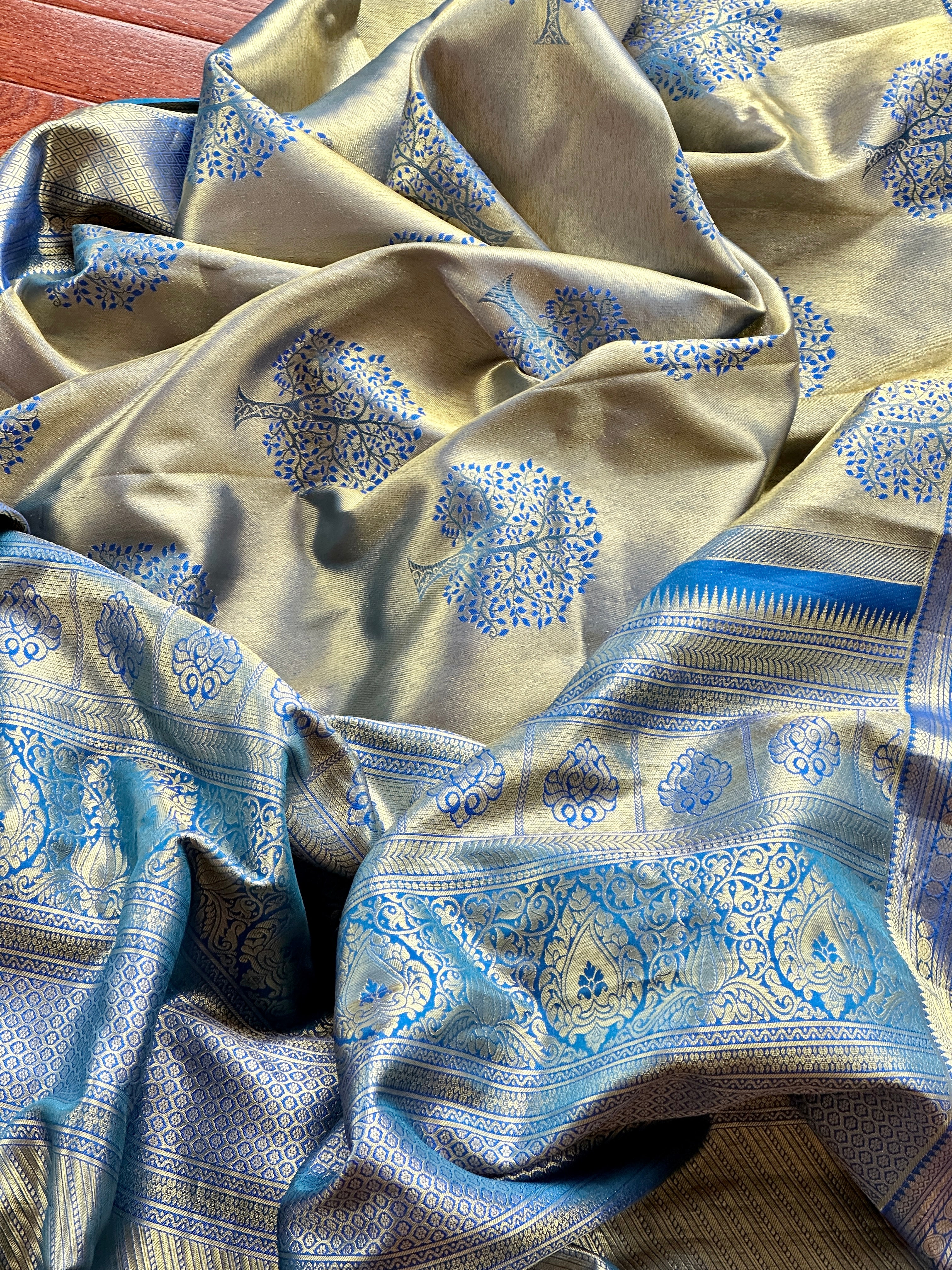 Buy golden zari blue Kanjivaram silk sari online in USA with tree motifs. Look your best on festive occasions in latest designer sarees, pure silk sarees, Kanjivaram silk saris, handwoven saris, tussar silk sarees, embroidered saris from Pure Elegance Indian clothing store in USA.-closeup