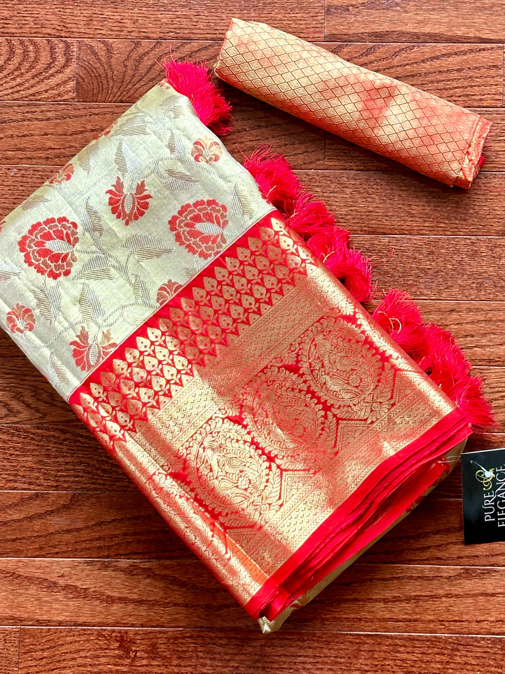 Shop cream Kanjivaram silk sari online in USA with red zari border. Look your best on festive occasions in latest designer sarees, pure silk sarees, Kanjivaram silk saris, handwoven saris, tussar silk sarees, embroidered saris from Pure Elegance Indian clothing store in USA.-full view