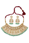 Buy gold plated white glass choker necklace set online in USA with green stones. Elevate your traditional look with royal Amrapali jewelry, silver plated jewelry, gold plated jewelry, gold plated necklace, silver earrings, silver bangles from Pure Elegance Indian fashion store in USA.-front