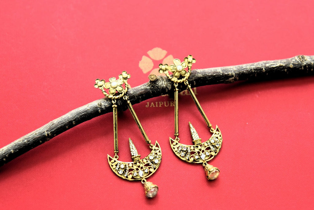 Shop stunning gold plated floral dangler earrings online in USA. Elevate your traditional look with royal Amrapali jewelry, silver plated jewelry, gold plated jewelry, gold plated necklace, silver earrings, silver bangles from Pure Elegance Indian fashion store in USA.-front