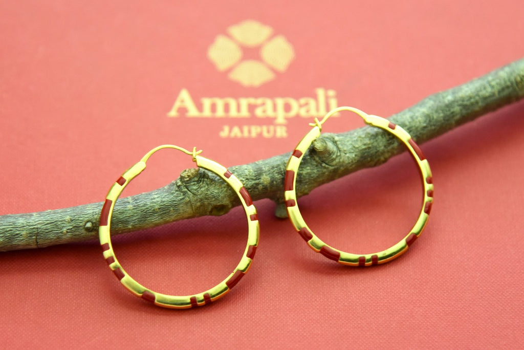 Shop Amrapali red enamel gold plated hoops online in USA. Elevate your traditional look with royal Amrapali jewelry, silver plated jewelry, gold plated jewelry, gold plated necklace, silver earrings, silver bangles from Pure Elegance Indian fashion store in USA.-front