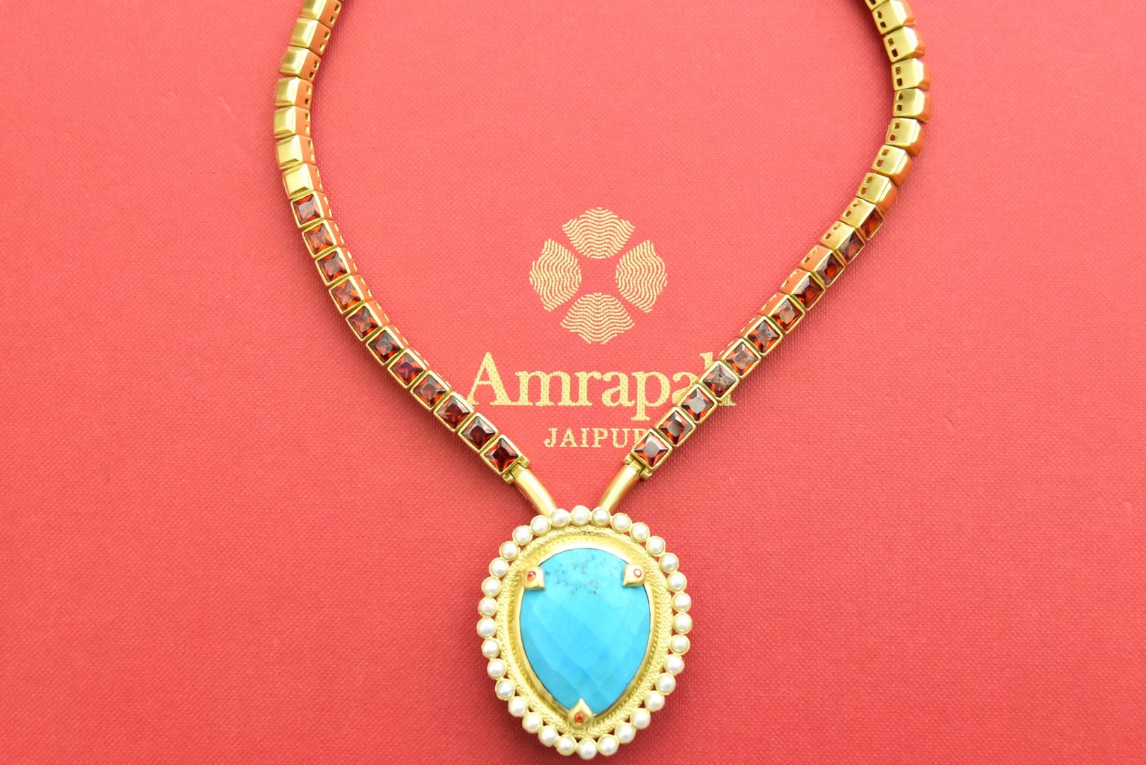 Shop gold plated necklace online in USA with turquoise drop pendant. Elevate your traditional look with royal Amrapali jewelry, silver plated jewelry, gold plated jewelry, gold plated necklace, silver earrings, silver bangles from Pure Elegance Indian fashion store in USA.-front