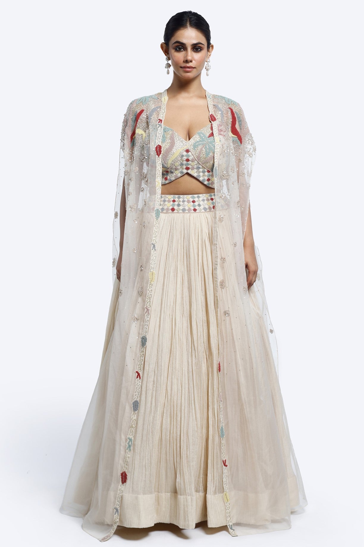 Buy ivory embroidered crush fabric lehenga online in USA with cape. Shop the best and latest designs in embroidered sarees, designer sarees, Anarkali suit, lehengas, sharara suits for weddings and special occasions from Pure Elegance Indian fashion store in USA.-full view