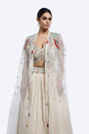 Buy ivory embroidered crush fabric lehenga online in USA with cape. Shop the best and latest designs in embroidered sarees, designer sarees, Anarkali suit, lehengas, sharara suits for weddings and special occasions from Pure Elegance Indian fashion store in USA.-closeup