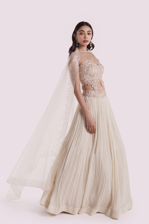 Shop ivory embroidered georgette lehenga with dupatta online in USA. Shop the best and latest designs in embroidered sarees, designer sarees, Anarkali suit, lehengas, sharara suits for weddings and special occasions from Pure Elegance Indian fashion store in USA.-side