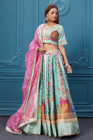 Buy embroidered pastel blue lehenga with a contrasting pink gotta pati dupatta online in the USA. Featuring embroidered blouse with 3/4th sleeves blouse The Lehenga comes with a look royal at weddings and festive occasions in exquisite designer sarees, gowns, lehngas, Anarkali, and suits Pure Elegance Indian saree stores in the USA.