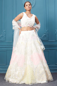 Shop an off-white floral lehenga with silver embroidery and a sleeveless blouse. Dazzle on weddings and special occasions with exquisite Indian designer dresses, sharara suits, Anarkali suits, bridal lehengas, and sharara suits from Pure Elegance Indian clothing store in the USA. Shop online from Pure Elegance.