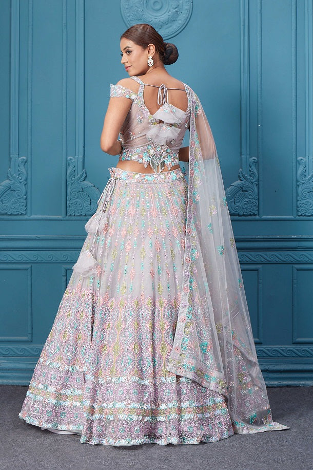 Buy this light pink lehenga with heavy multicolor sequin & mirror embroidery. Dazzle on weddings and special occasions with exquisite Indian designer dresses, sharara suits, Anarkali suits, bridal lehengas, and sharara suits from Pure Elegance Indian clothing store in the USA. Shop online from Pure Elegance.