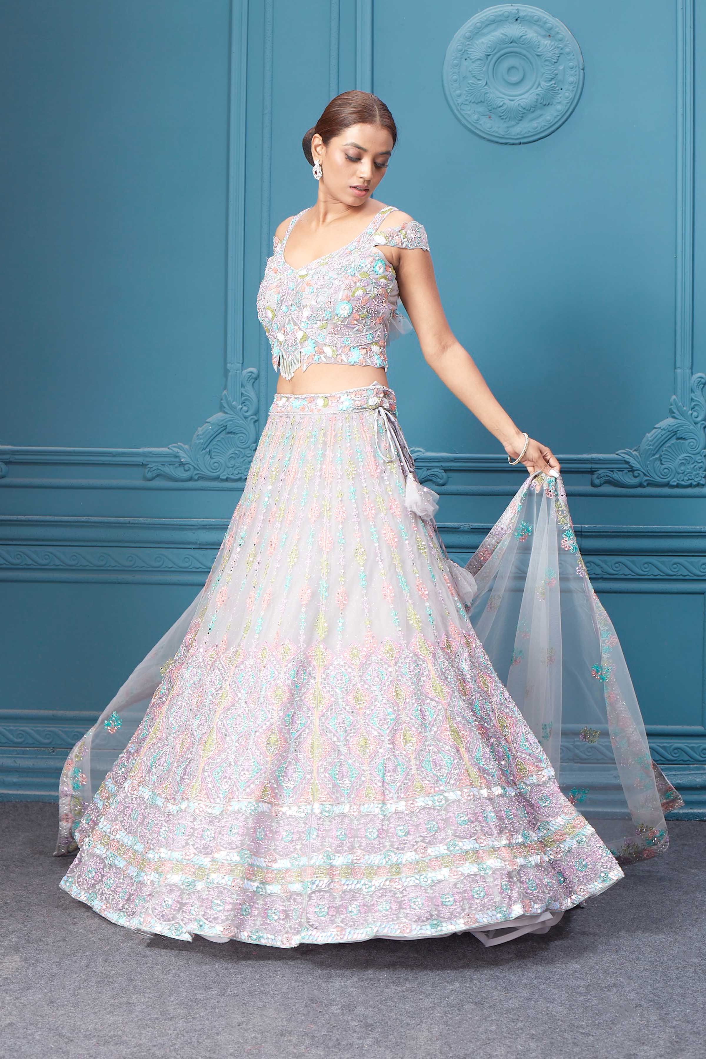 Buy this light pink lehenga with heavy multicolor sequin & mirror embroidery. Dazzle on weddings and special occasions with exquisite Indian designer dresses, sharara suits, Anarkali suits, bridal lehengas, and sharara suits from Pure Elegance Indian clothing store in the USA. Shop online from Pure Elegance.