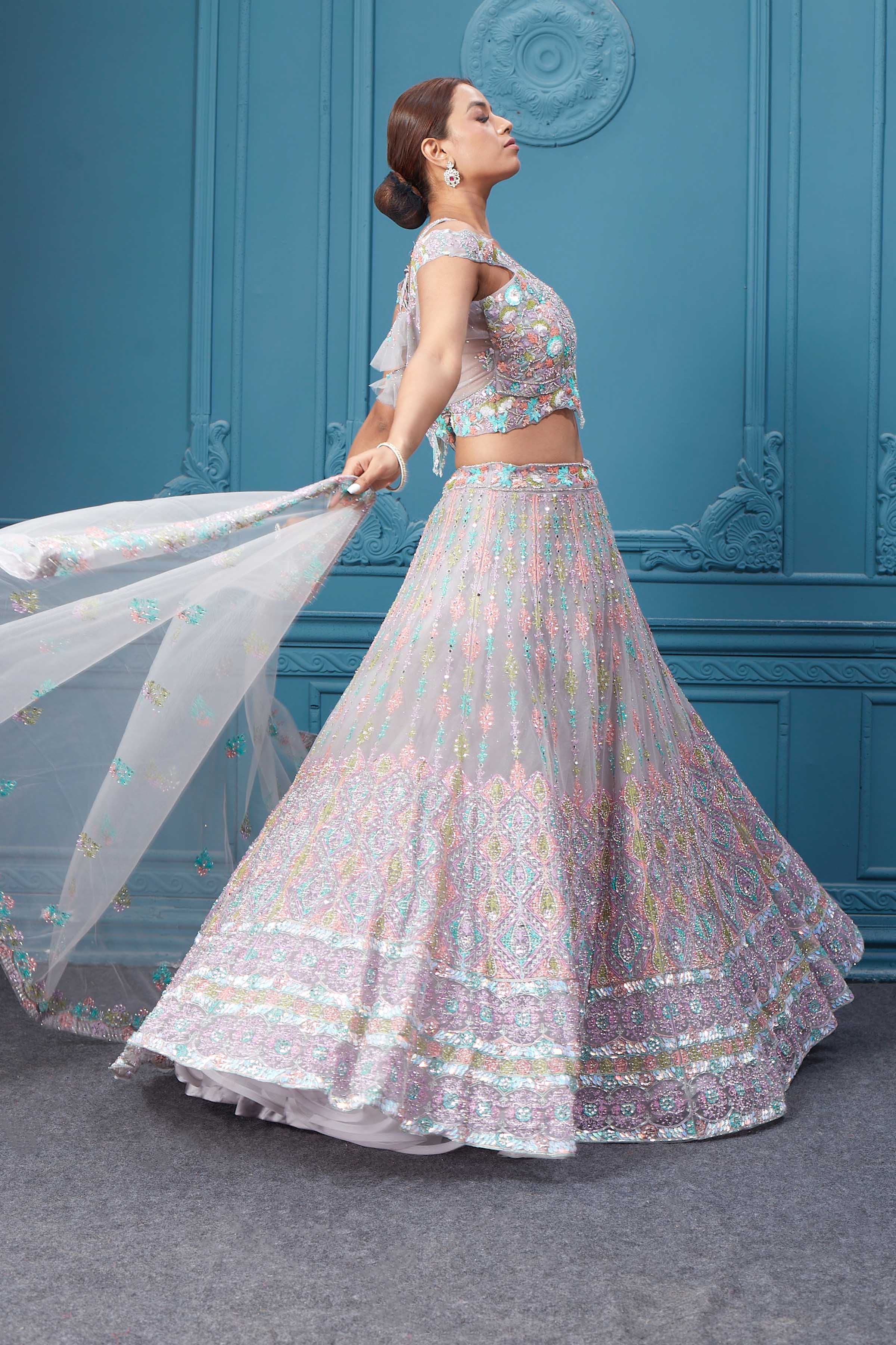 Buy this light pink lehenga with heavy multicolor sequin & mirror embroidery. Dazzle on weddings and special occasions with exquisite Indian designer dresses, sharara suits, Anarkali suits, bridal lehengas, and sharara suits from Pure Elegance Indian clothing store in the USA. Shop online from Pure Elegance.