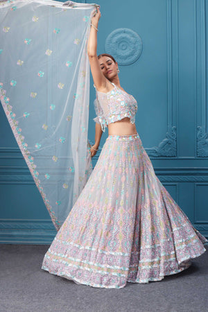 Buy this light pink lehenga with heavy multicolor sequin & mirror embroidery. Dazzle on weddings and special occasions with exquisite Indian designer dresses, sharara suits, Anarkali suits, bridal lehengas, and sharara suits from Pure Elegance Indian clothing store in the USA. Shop online from Pure Elegance.