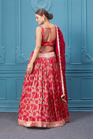 Shop this red lehenga with golden embroidery. Dazzle on weddings and special occasions with exquisite Indian designer dresses, sharara suits, Anarkali suits, bridal lehengas, and sharara suits from Pure Elegance Indian clothing store in the USA. Shop online from Pure Elegance.