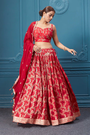 Shop this red lehenga with golden embroidery. Dazzle on weddings and special occasions with exquisite Indian designer dresses, sharara suits, Anarkali suits, bridal lehengas, and sharara suits from Pure Elegance Indian clothing store in the USA. Shop online from Pure Elegance.