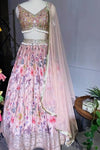 Shop pink printed lehenga set with heavy embroidery on the blouse. Make a fashion statement on festive occasions and weddings with designer sarees, designer suits, Indian dresses, Anarkali suits, palazzo suits, designer gowns, sharara suits, and embroidered sarees from Pure Elegance Indian fashion store in the USA.