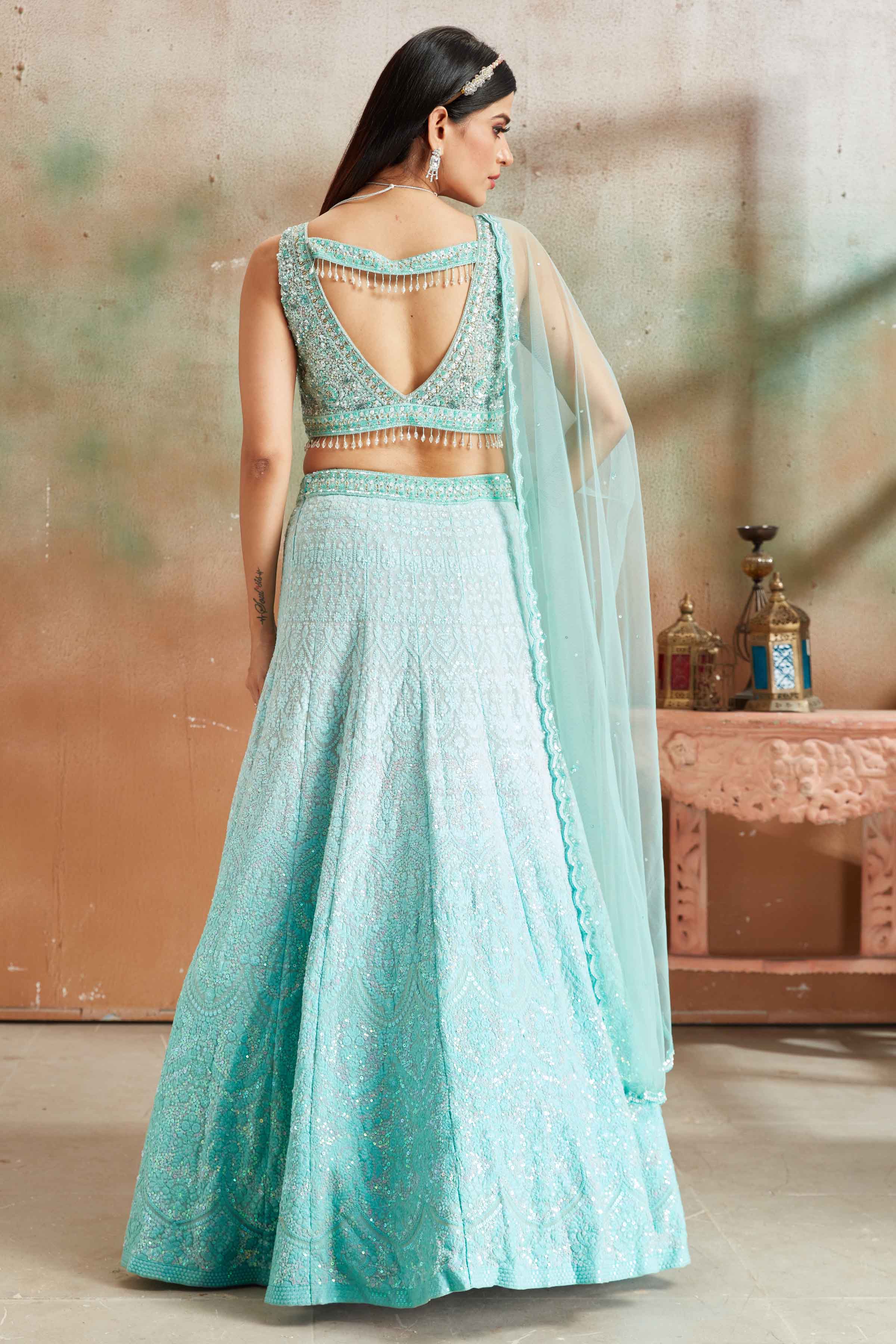 Buy pastel blue Lucknowi georgette lehenga online in USA with dupatta. Look your best on festive occasions in latest designer saris, pure silk sarees, Kanjivaram silk sarees, handwoven saris, tussar silk sarees, embroidered saris from Pure Elegance Indian clothing store in USA.-back