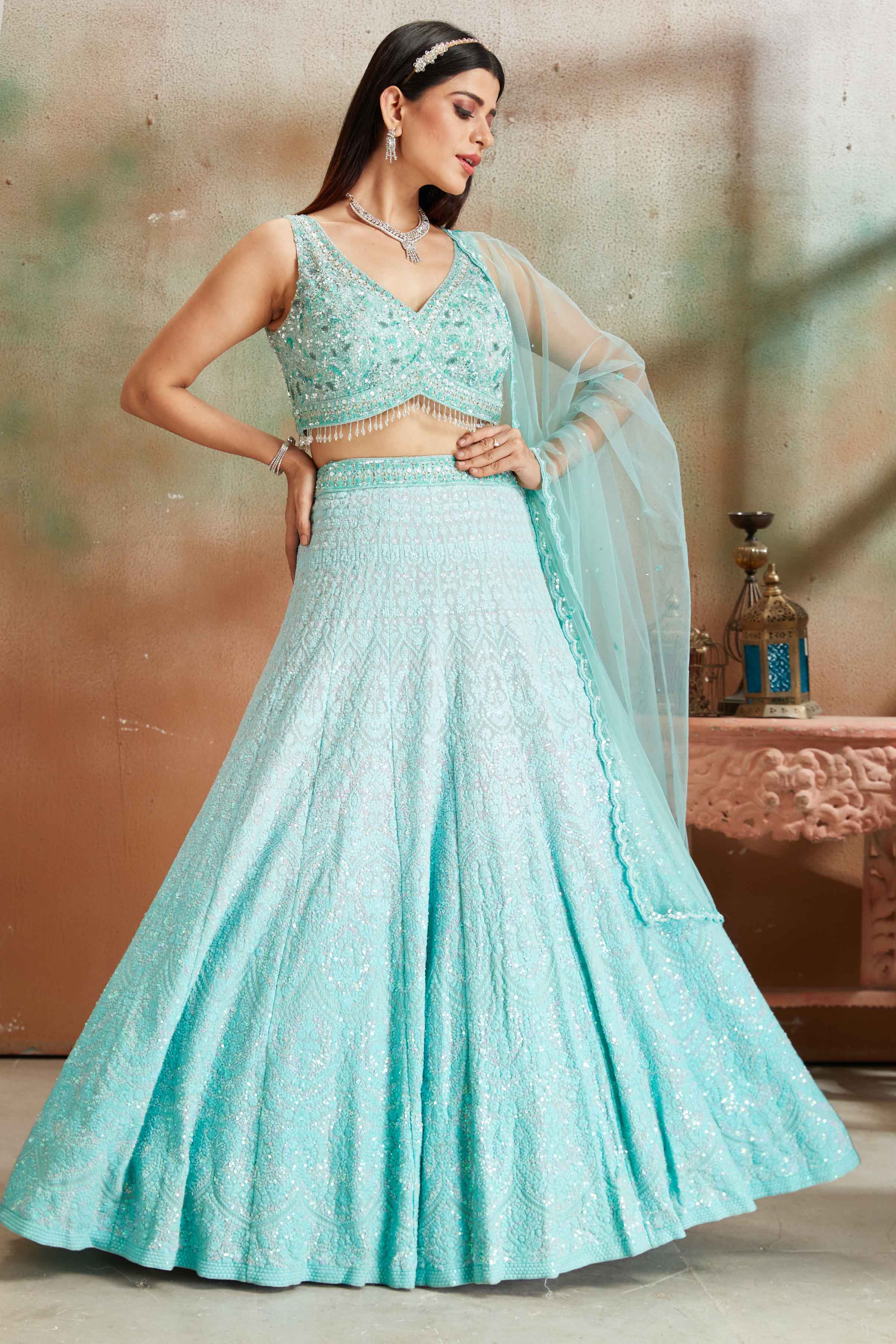 Buy pastel blue Lucknowi georgette lehenga online in USA with dupatta. Look your best on festive occasions in latest designer saris, pure silk sarees, Kanjivaram silk sarees, handwoven saris, tussar silk sarees, embroidered saris from Pure Elegance Indian clothing store in USA.-full view