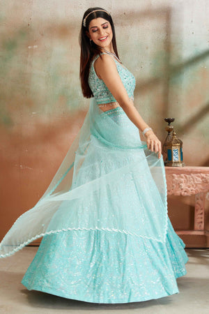 Buy pastel blue Lucknowi georgette lehenga online in USA with dupatta. Look your best on festive occasions in latest designer saris, pure silk sarees, Kanjivaram silk sarees, handwoven saris, tussar silk sarees, embroidered saris from Pure Elegance Indian clothing store in USA.-side