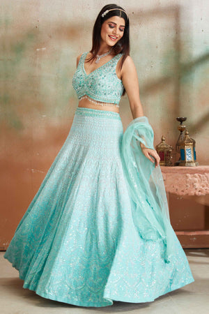 Buy pastel blue Lucknowi georgette lehenga online in USA with dupatta. Look your best on festive occasions in latest designer saris, pure silk sarees, Kanjivaram silk sarees, handwoven saris, tussar silk sarees, embroidered saris from Pure Elegance Indian clothing store in USA.-lehenga