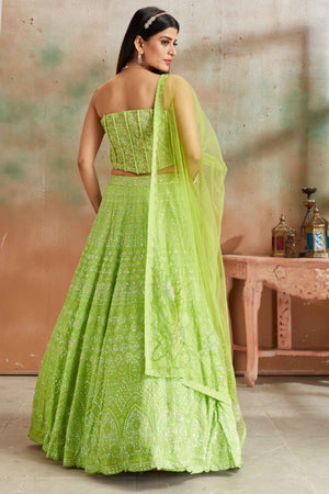 Buy pastel green Lucknowi georgette lehenga online in USA with corset blouse and dupatta. Look your best on festive occasions in latest designer saris, pure silk sarees, Kanjivaram silk sarees, handwoven saris, tussar silk sarees, embroidered saris from Pure Elegance Indian clothing store in USA.-back