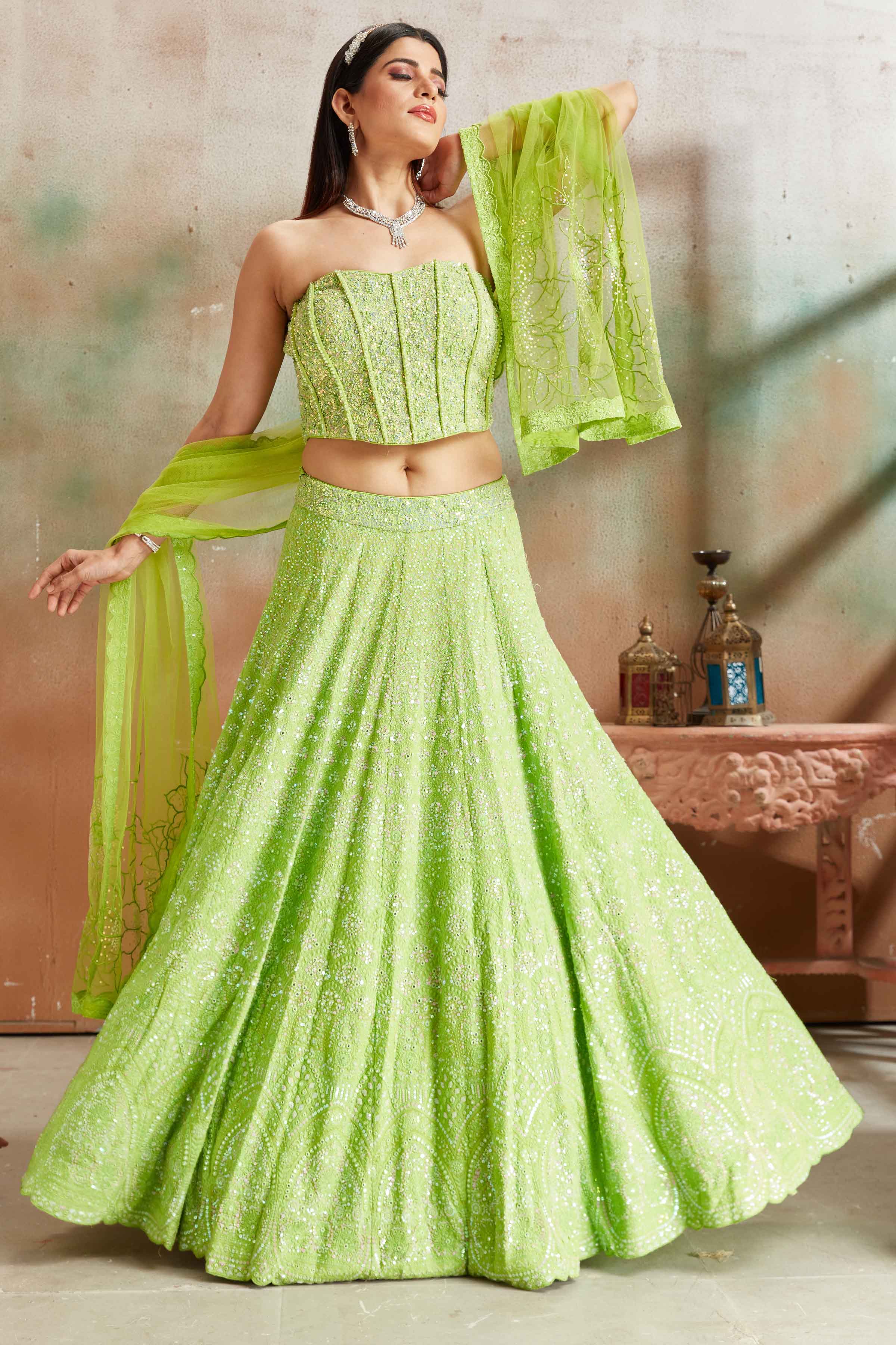 Buy pastel green Lucknowi georgette lehenga online in USA with corset blouse and dupatta. Look your best on festive occasions in latest designer saris, pure silk sarees, Kanjivaram silk sarees, handwoven saris, tussar silk sarees, embroidered saris from Pure Elegance Indian clothing store in USA.-side