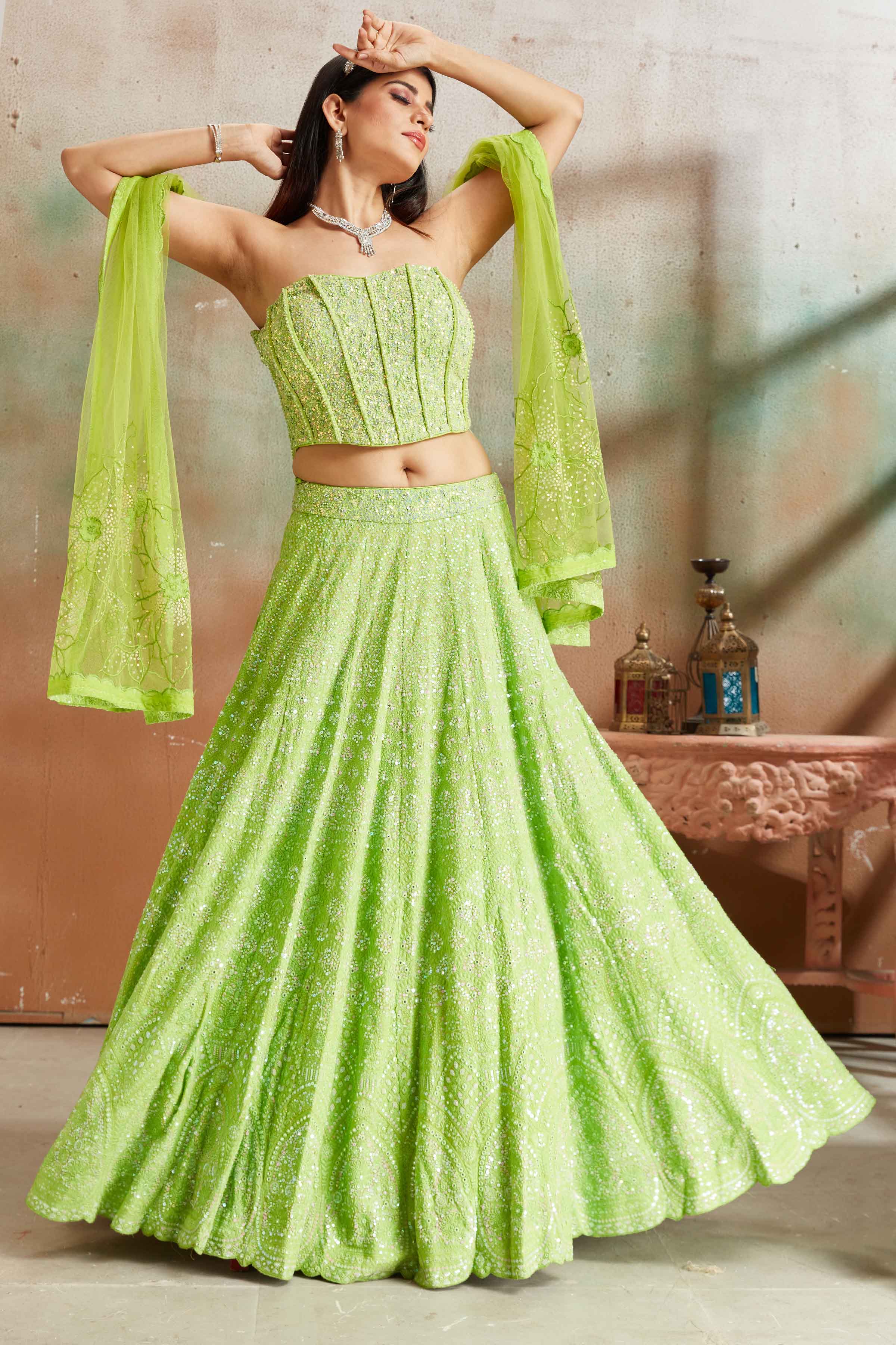 Buy pastel green Lucknowi georgette lehenga online in USA with corset blouse and dupatta. Look your best on festive occasions in latest designer saris, pure silk sarees, Kanjivaram silk sarees, handwoven saris, tussar silk sarees, embroidered saris from Pure Elegance Indian clothing store in USA.-lehenga