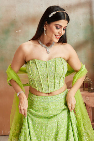 Buy pastel green Lucknowi georgette lehenga online in USA with corset blouse and dupatta. Look your best on festive occasions in latest designer saris, pure silk sarees, Kanjivaram silk sarees, handwoven saris, tussar silk sarees, embroidered saris from Pure Elegance Indian clothing store in USA.-closeup