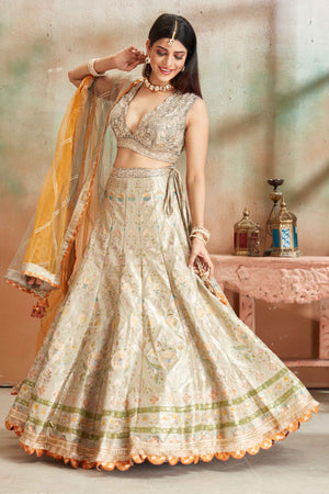 Buy sage green embroidered Banarasi silk lehenga online in USA with dupatta. Look your best on festive occasions in latest designer saris, pure silk sarees, Kanjivaram silk sarees, handwoven saris, tussar silk sarees, embroidered saris from Pure Elegance Indian clothing store in USA.-lehenga