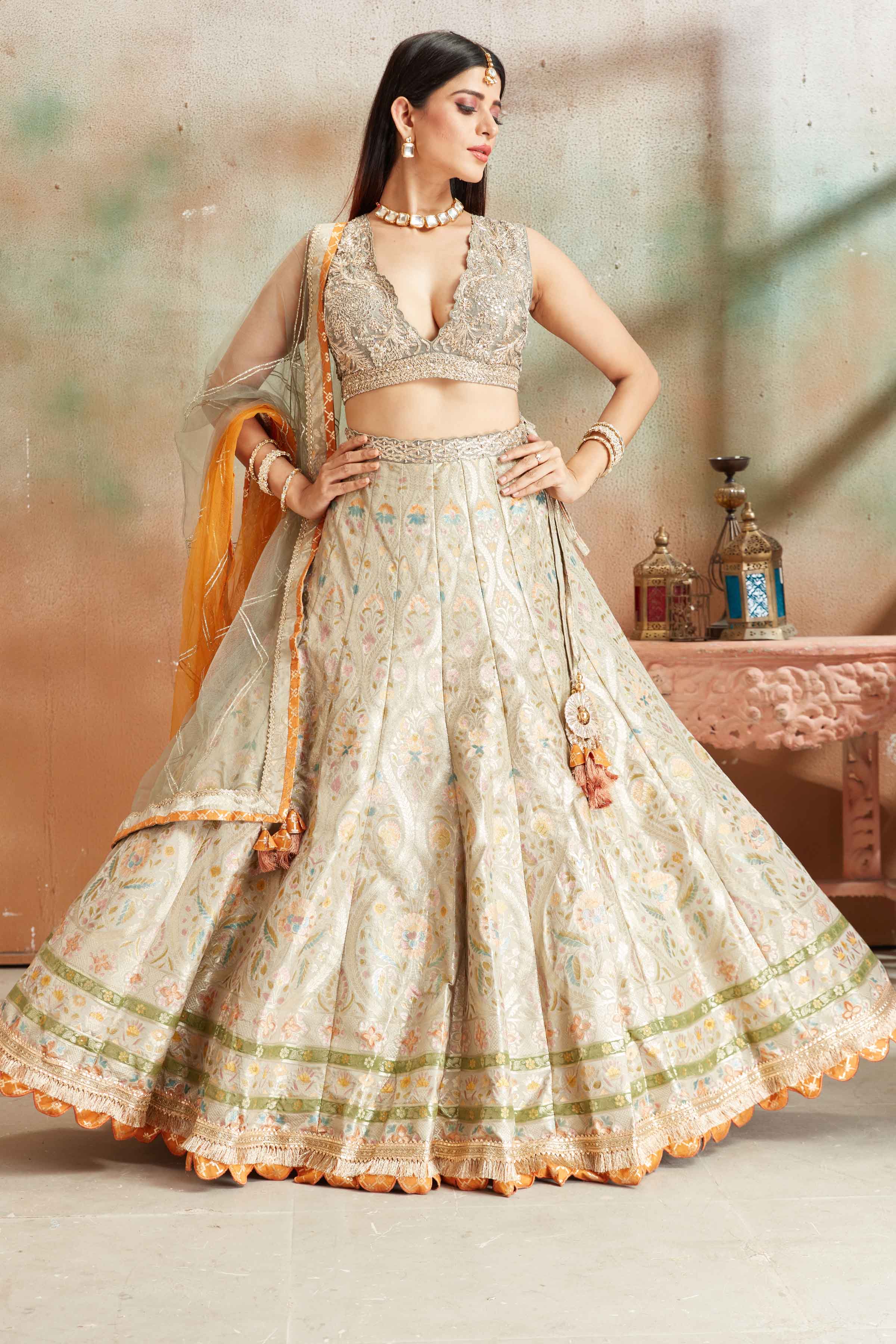 Buy sage green embroidered Banarasi silk lehenga online in USA with dupatta. Look your best on festive occasions in latest designer saris, pure silk sarees, Kanjivaram silk sarees, handwoven saris, tussar silk sarees, embroidered saris from Pure Elegance Indian clothing store in USA.-full view