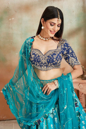 Shop sea green embroidered Banarasi silk lehenga online in USA with blue blouse. Look your best on festive occasions in latest designer saris, pure silk sarees, Kanjivaram silk sarees, handwoven saris, tussar silk sarees, embroidered saris from Pure Elegance Indian clothing store in USA.-closeup