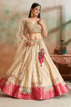 Buy cream embroidered lehenga online in USA with pink Banarasi border and dupatta. Look your best on festive occasions in latest designer saris, pure silk sarees, Kanjivaram silk sarees, handwoven saris, tussar silk sarees, embroidered saris from Pure Elegance Indian clothing store in USA.-full view