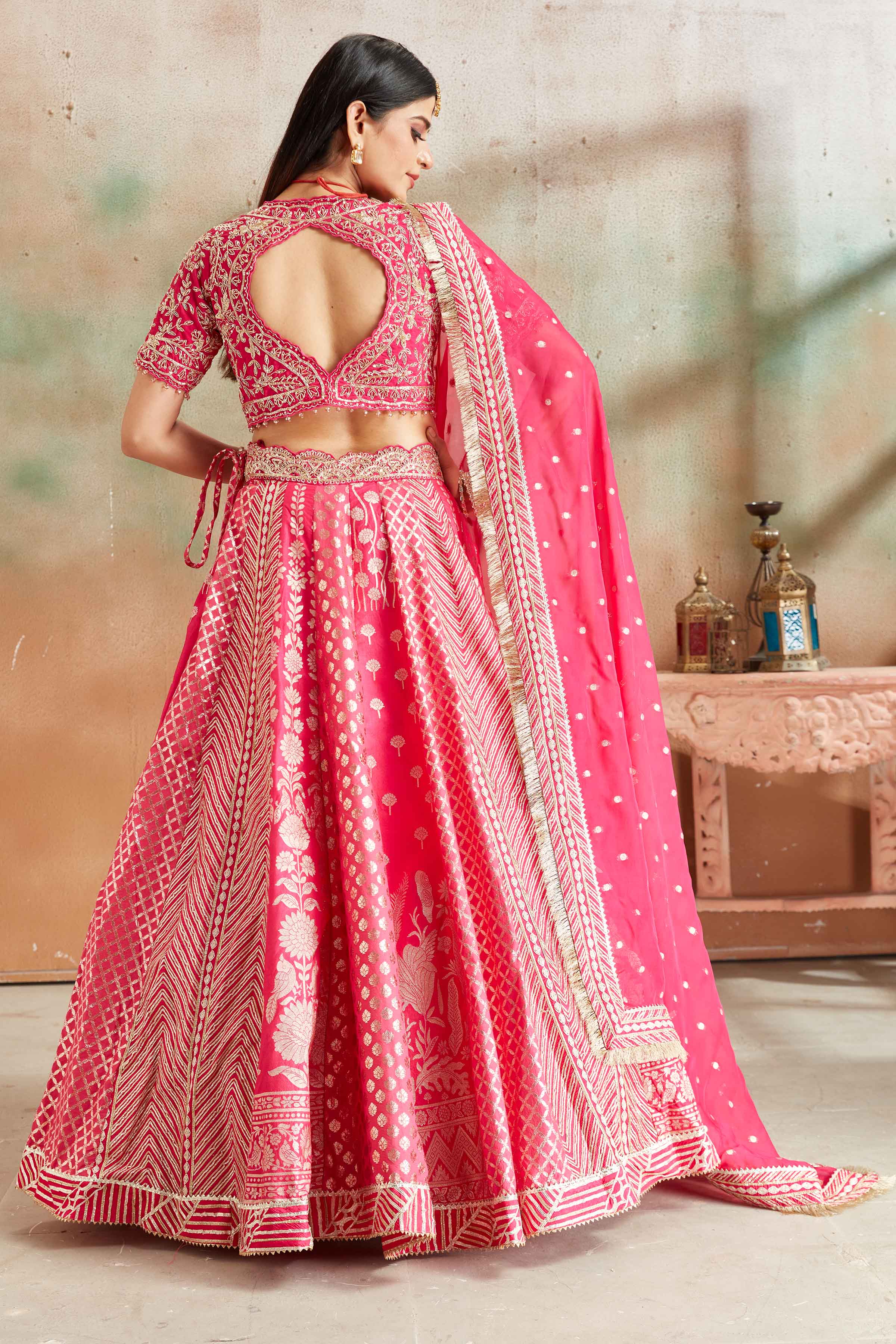 Buy fuschia pink embroidered Banarasi silk lehenga online in USA with dupatta. Look your best on festive occasions in latest designer saris, pure silk sarees, Kanjivaram silk sarees, handwoven saris, tussar silk sarees, embroidered saris from Pure Elegance Indian clothing store in USA.-back