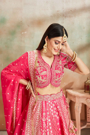 Buy fuschia pink embroidered Banarasi silk lehenga online in USA with dupatta. Look your best on festive occasions in latest designer saris, pure silk sarees, Kanjivaram silk sarees, handwoven saris, tussar silk sarees, embroidered saris from Pure Elegance Indian clothing store in USA.-closeup