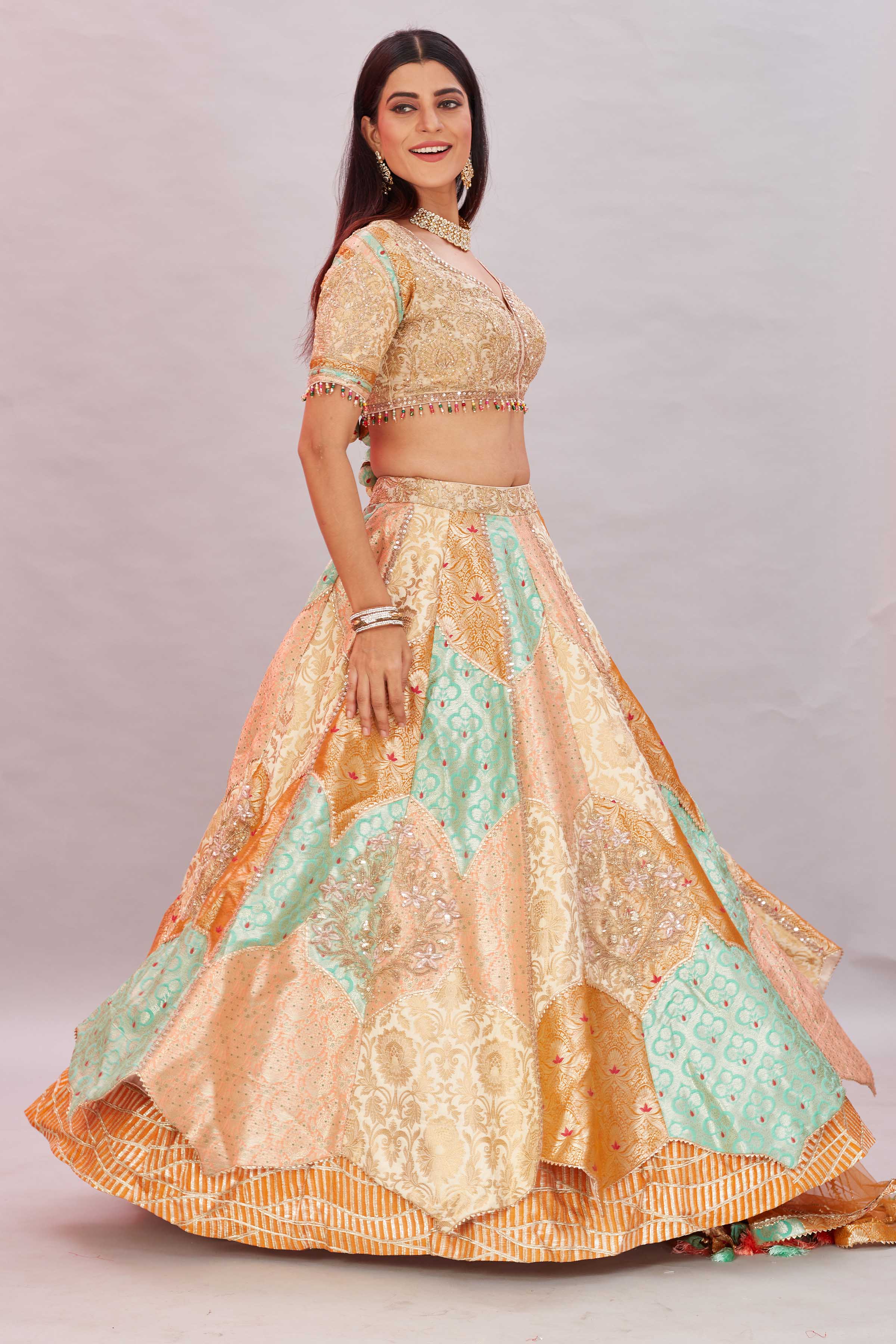 Buy multicolor peach embroidered silk lehenga sari online in USA with dupatta. Look your best on festive occasions in latest designer saris, pure silk sarees, Kanjivaram silk sarees, handwoven saris, tussar silk sarees, embroidered saris from Pure Elegance Indian clothing store in USA.-side