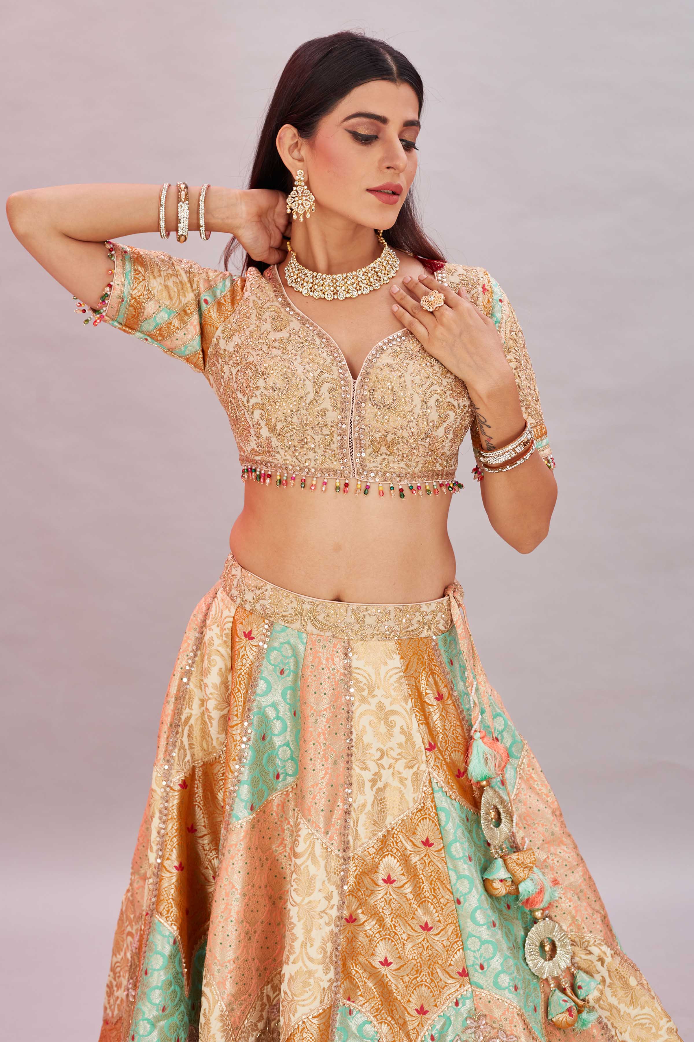 Buy multicolor peach embroidered silk lehenga sari online in USA with dupatta. Look your best on festive occasions in latest designer saris, pure silk sarees, Kanjivaram silk sarees, handwoven saris, tussar silk sarees, embroidered saris from Pure Elegance Indian clothing store in USA.-closeup