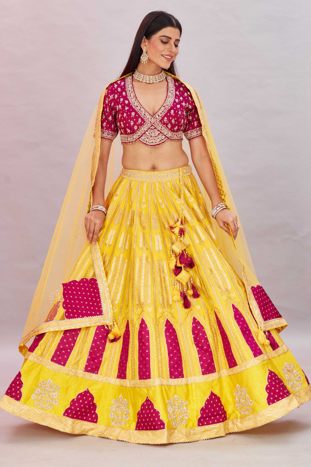 Buy magenta and yellow embroidered silk lehenga online in USA with dupatta. Look your best on festive occasions in latest designer saris, pure silk sarees, Kanjivaram silk sarees, handwoven saris, tussar silk sarees, embroidered saris from Pure Elegance Indian clothing store in USA.-full view