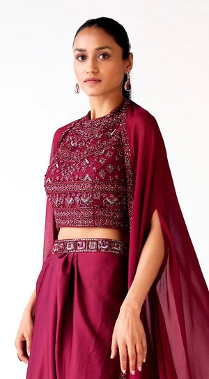 Buy wine satin embroidered draped skirt set online in USA with cape. Shop the best and latest designs in embroidered sarees, designer sarees, Anarkali suit, lehengas, sharara suits, kaftans for weddings and special occasions from Pure Elegance Indian fashion store in USA.-closeup