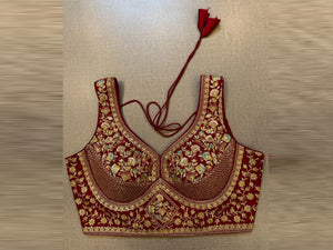 Buy maroon heavy embroidery sleeveless saree blouse online in USA. Elevate your saree style with exquisite readymade sari blouses, embroidered saree blouses, Banarasi sari blouse, designer saree blouse, choli-cut blouses, corset blouses from Pure Elegance Indian fashion store in USA.-front