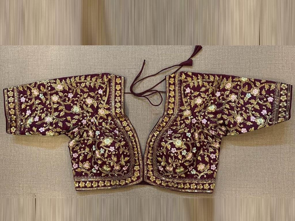 Shop stunning maroon heavy embroidered saree blouse online in USA. Elevate your saree style with exquisite readymade sari blouses, embroidered saree blouses, Banarasi sari blouse, designer saree blouse, choli-cut blouses, corset blouses from Pure Elegance Indian fashion store in USA.-front