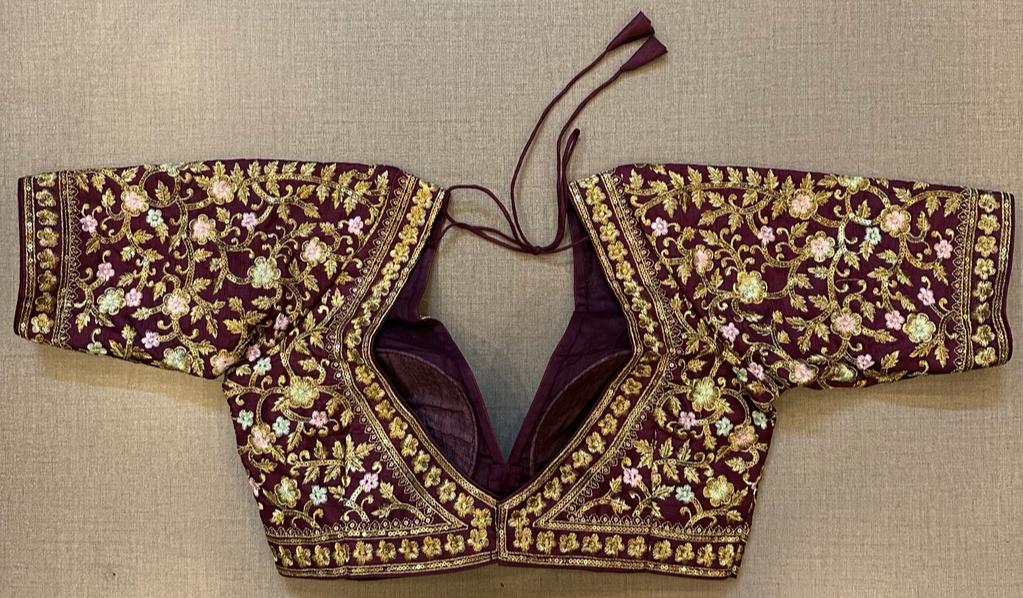 Shop stunning maroon heavy embroidered saree blouse online in USA. Elevate your saree style with exquisite readymade sari blouses, embroidered saree blouses, Banarasi sari blouse, designer saree blouse, choli-cut blouses, corset blouses from Pure Elegance Indian fashion store in USA.-back