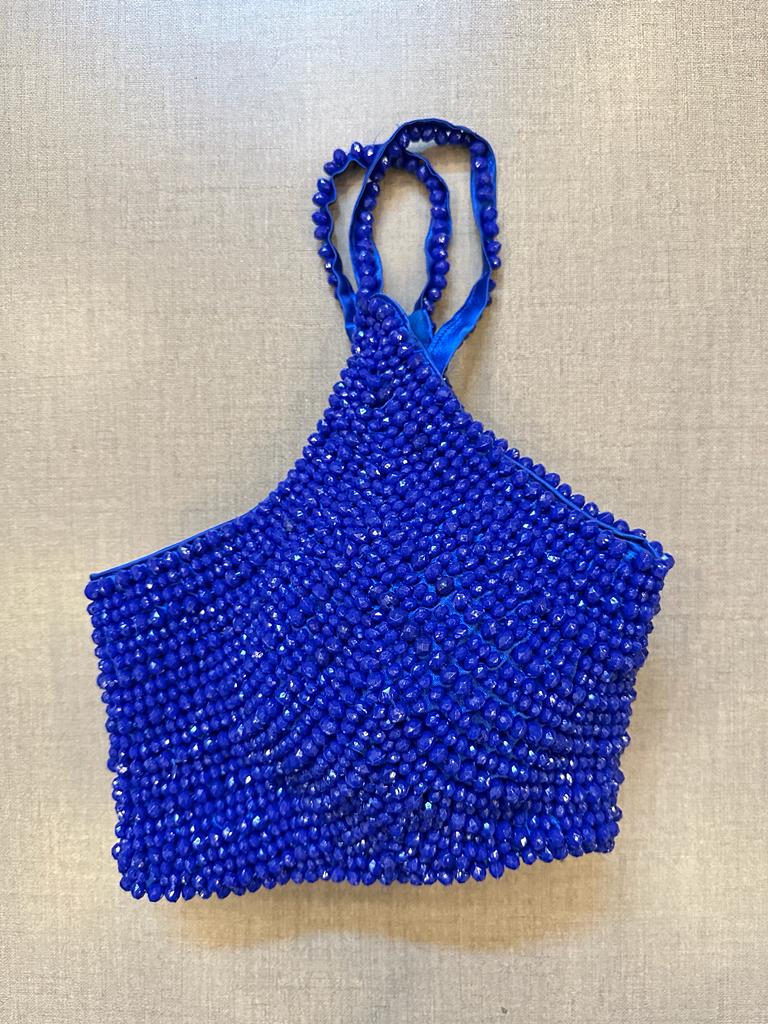 Shop stunning blue bead work strappy cocktail blouse online in USA. Elevate your saree style with exquisite readymade sari blouses, embroidered saree blouses, Banarasi sari blouse, designer saree blouse, choli-cut blouses, corset blouses from Pure Elegance Indian fashion store in USA.-side