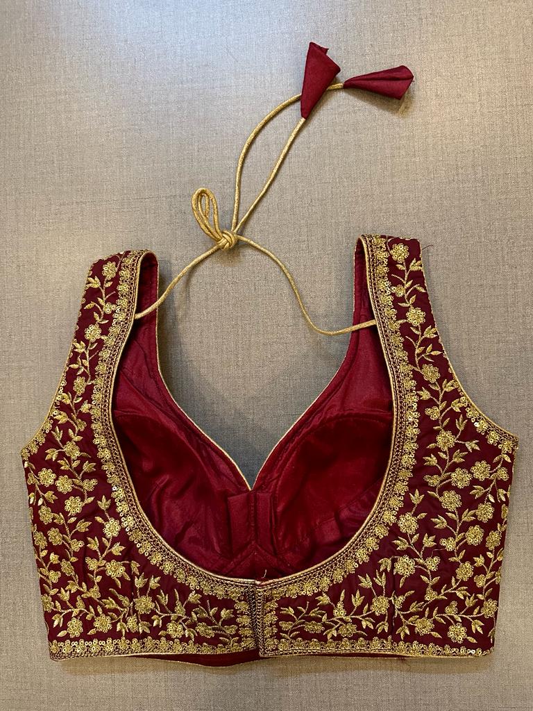 Buy maroon heavy embroidery sleeveless saree blouse online in USA. Elevate your saree style with exquisite readymade sari blouses, embroidered saree blouses, Banarasi sari blouse, designer saree blouse, choli-cut blouses, corset blouses from Pure Elegance Indian fashion store in USA.-back