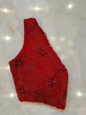 Shop red hand embroidery sleeveless saree blouse online in USA. Elevate your saree style with exquisite readymade sari blouses, embroidered saree blouses, Banarasi sari blouse, designer saree blouse, choli-cut blouses, corset blouses from Pure Elegance Indian fashion store in USA.-side