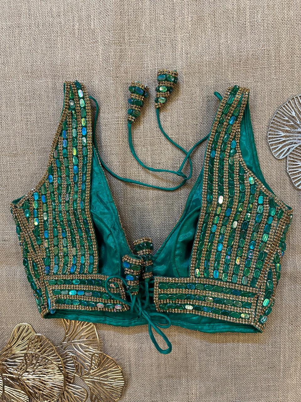 Buy green bead and zircon work sleeveless saree blouse online in USA. Elevate your saree style with exquisite readymade sari blouses, embroidered saree blouses, Banarasi sari blouse, designer saree blouse, choli-cut blouses, corset blouses from Pure Elegance Indian fashion store in USA.-back