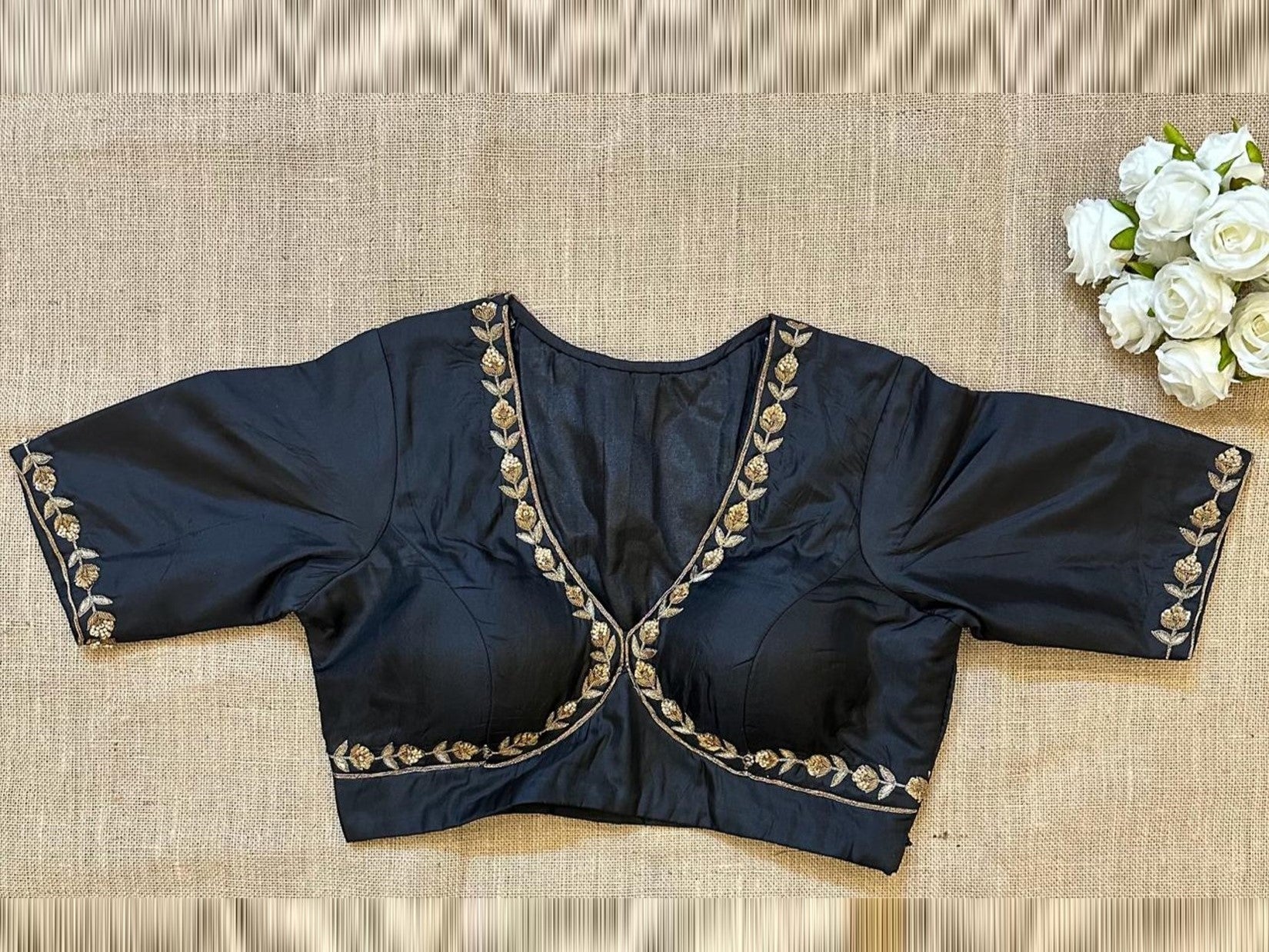 Buy black v-neck saree blouse online in USA with embroidery. Elevate your saree style with exquisite readymade saree blouses, embroidered saree blouses, Banarasi sari blouse, designer saree blouse, choli-cut blouses, corset blouses from Pure Elegance Indian fashion store in USA.-front