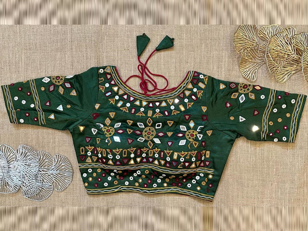 Shop dark green multicolor mirror work designer saree blouse online in USA. Elevate your saree style with exquisite readymade saree blouses, embroidered saree blouses, Banarasi sari blouse, designer saree blouse, choli-cut blouses, corset blouses from Pure Elegance Indian fashion store in USA.-front