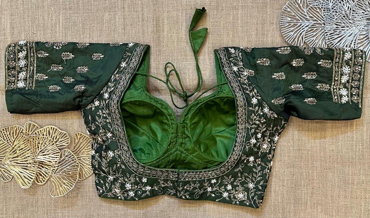 Shop dark green heavy embroidered designer sari blouse online in USA. Elevate your saree style with exquisite readymade saree blouses, embroidered saree blouses, Banarasi sari blouse, designer saree blouse, choli-cut blouses, corset blouses from Pure Elegance Indian fashion store in USA.-back