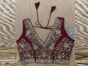 Shop maroon hand embroidered sleeveless saree blouse online in USA with pink patch sleeves. Elevate your saree style with exquisite readymade saree blouses, embroidered saree blouses, Banarasi sari blouse, designer saree blouse, choli-cut blouses, corset blouses from Pure Elegance Indian fashion store in USA.-front