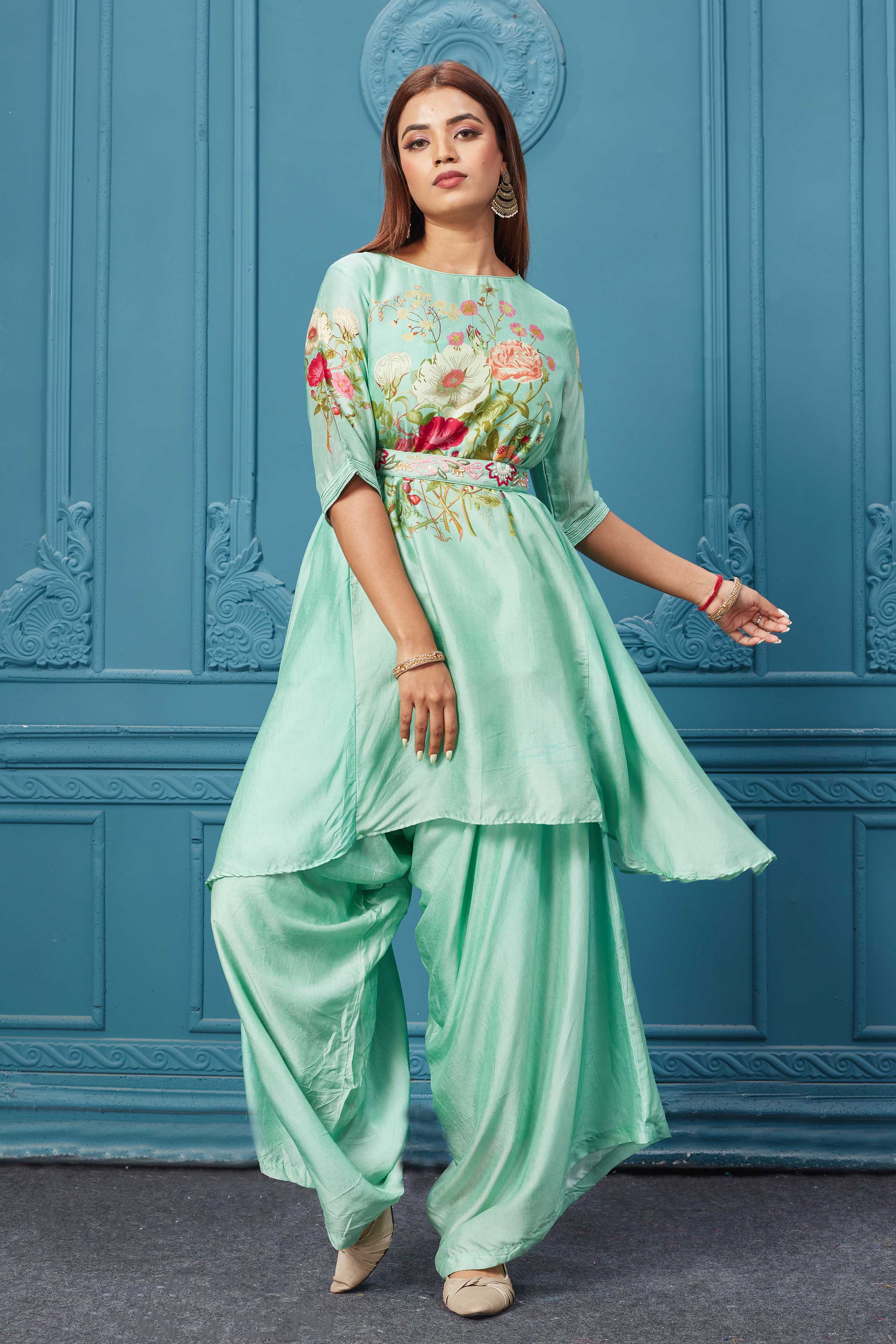 Shop Gorgeous neon green suit featuring a boat neck, quarter sleeves, and a stylish belt. Shop Indian dresses, gowns, Anarkali, lehenga, and saree online at Pure Elegance or visit our store in the USA.