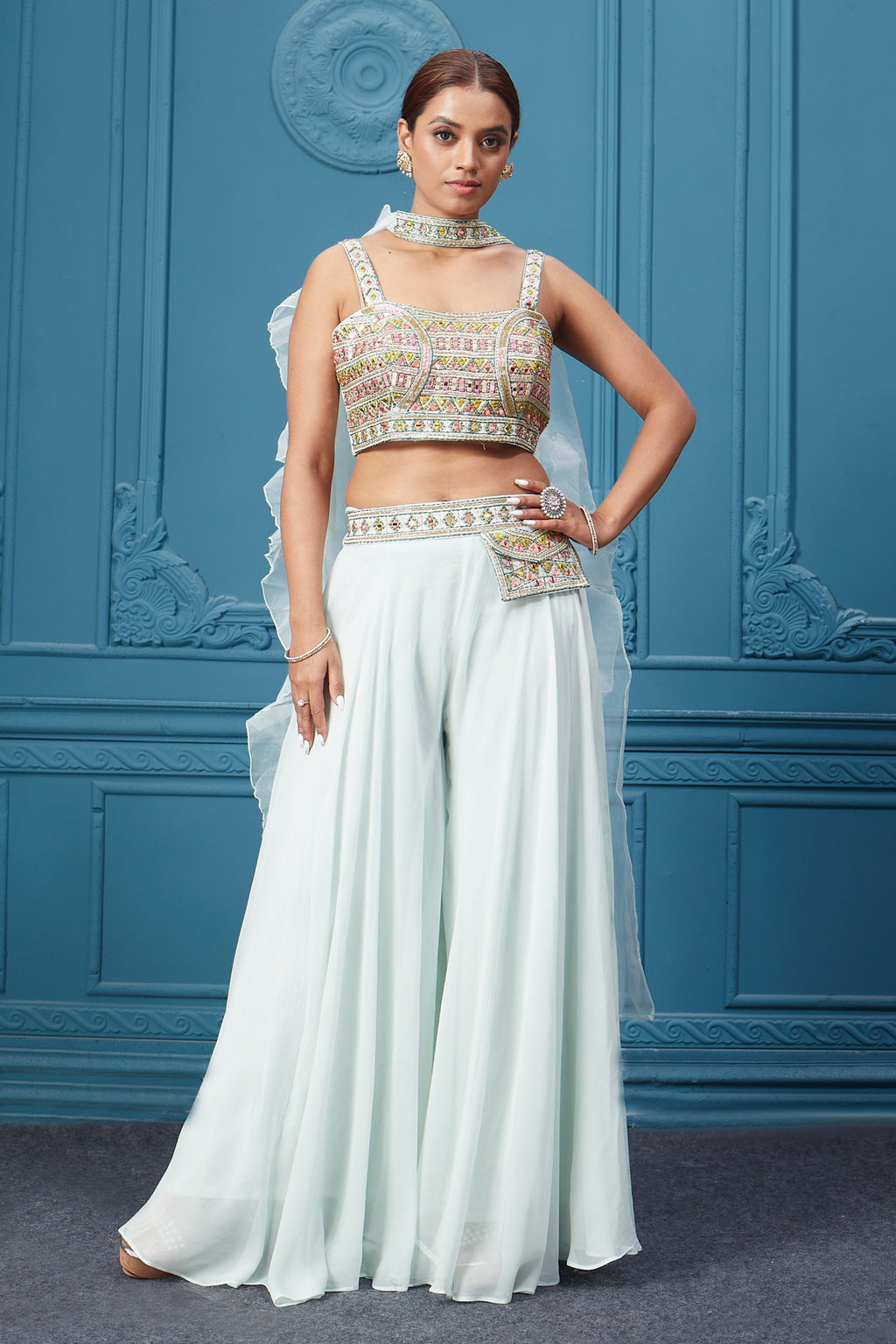 Buy a light blue suit set with mirror work on the crop top. Dazzle on special occasions with exquisite Indian designer dresses, sharara suits, Anarkali suits, bridal lehengas, and sharara suits from Pure Elegance Indian clothing store in the USA. Shop online from Pure Elegance.