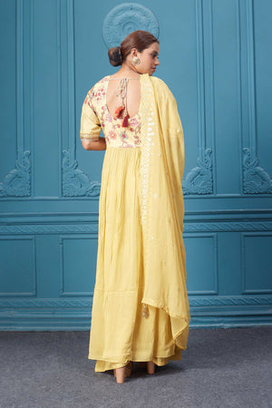 Shop a yellow naira cut suit set with mirror work and embroidered kurta, plazzo, 3/4th sleeves, and beautiful mirror work embroidered dupatta. Dazzle on special occasions with exquisite Indian designer dresses, sharara suits, Anarkali suits, bridal lehengas, and sharara suits from Pure Elegance Indian clothing store in the USA. Shop online from Pure Elegance.